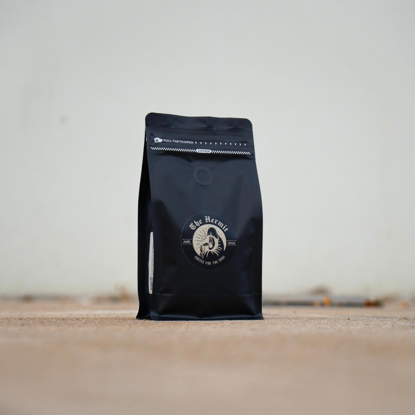 black specialty coffee bag from the hermit
